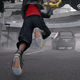 Sora running down a road while wearing his new, normal sized shoes as seen in the new trailer.